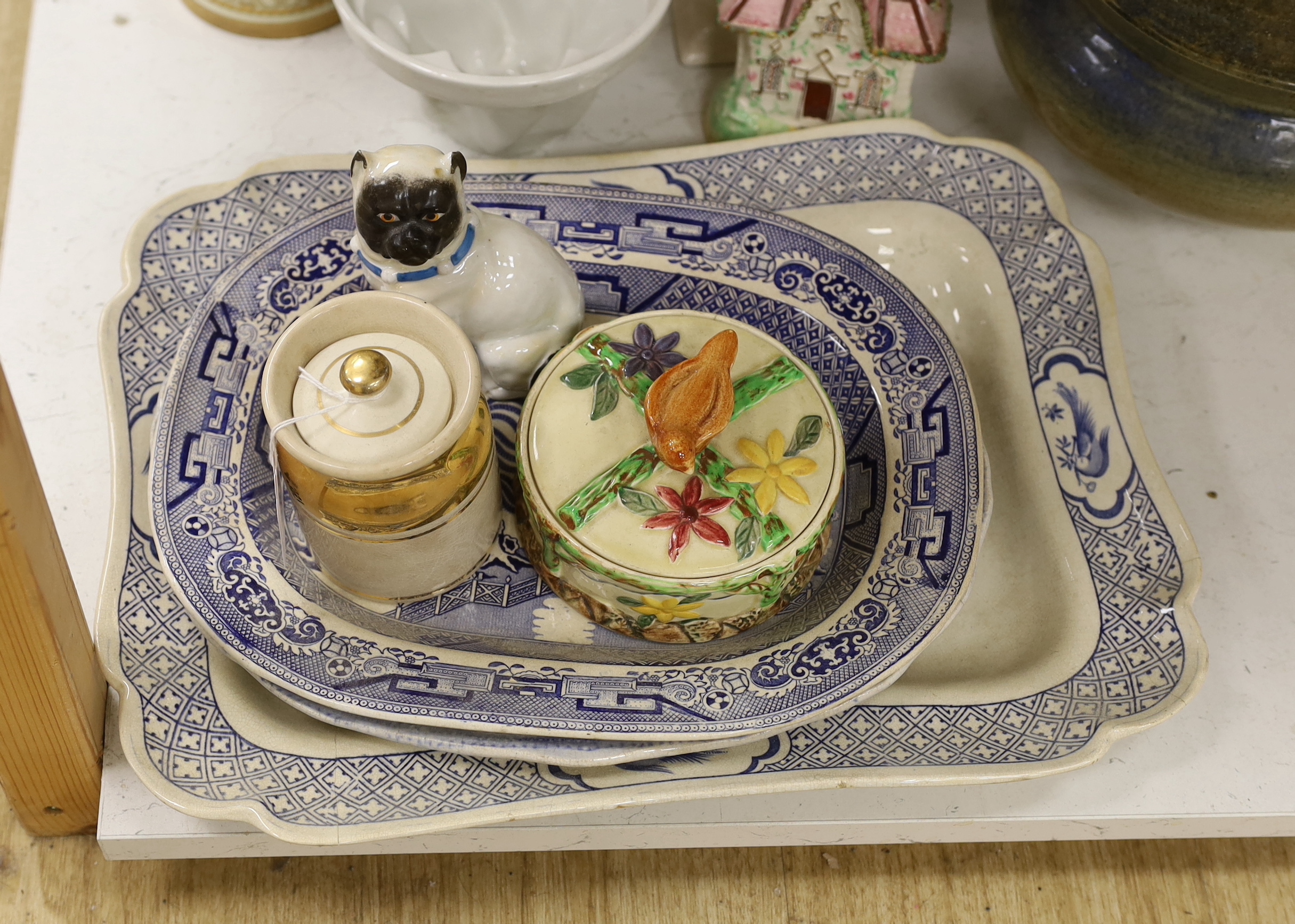 A large pottery tureen and cover, a large centrepiece and mixed ceramics including meat platters